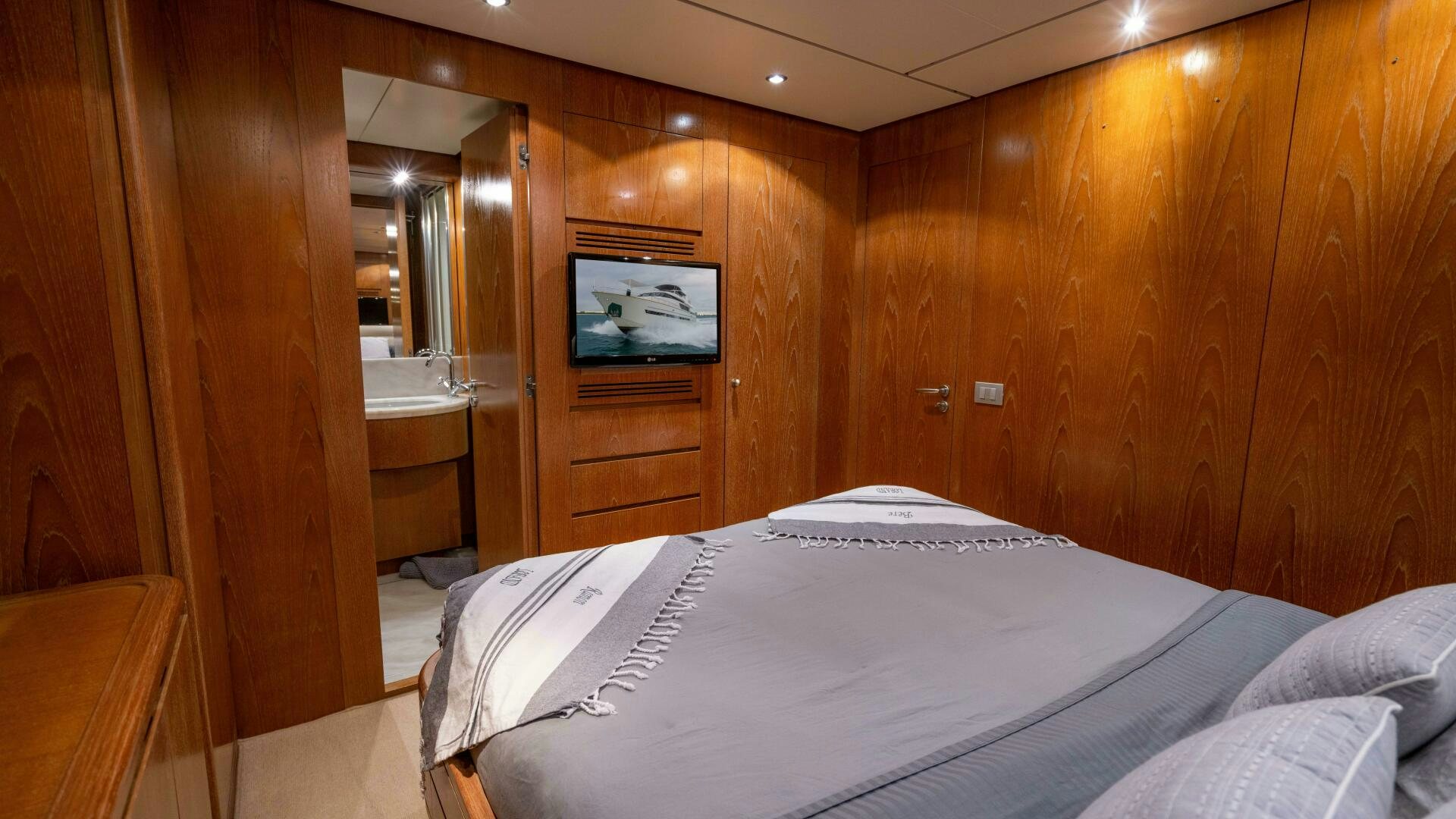 a hotel room with a bed aboard LOSAND Yacht for Sale