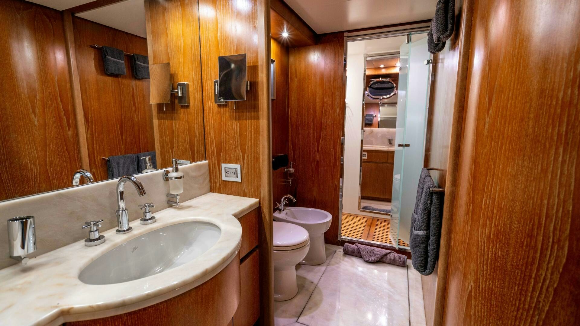 a bathroom with a sink and a toilet aboard LOSAND Yacht for Sale