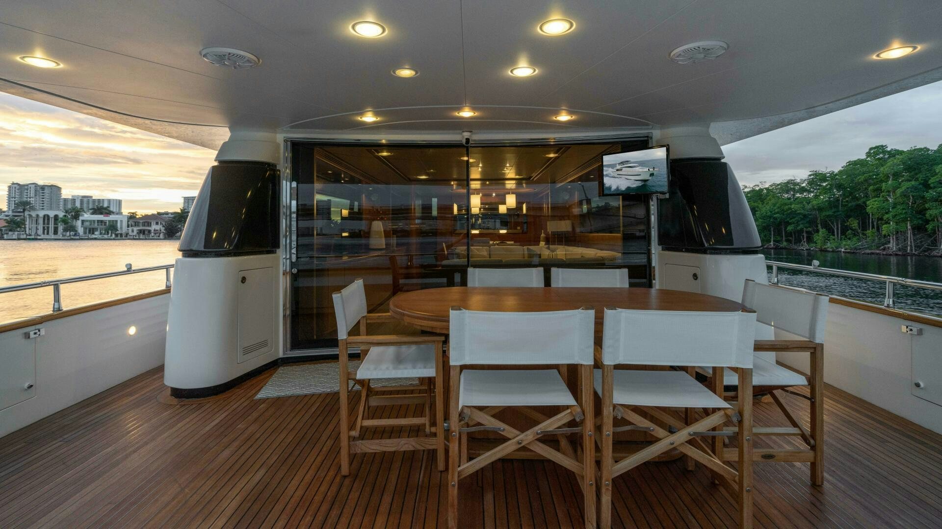 a room with a table and chairs aboard LOSAND Yacht for Sale