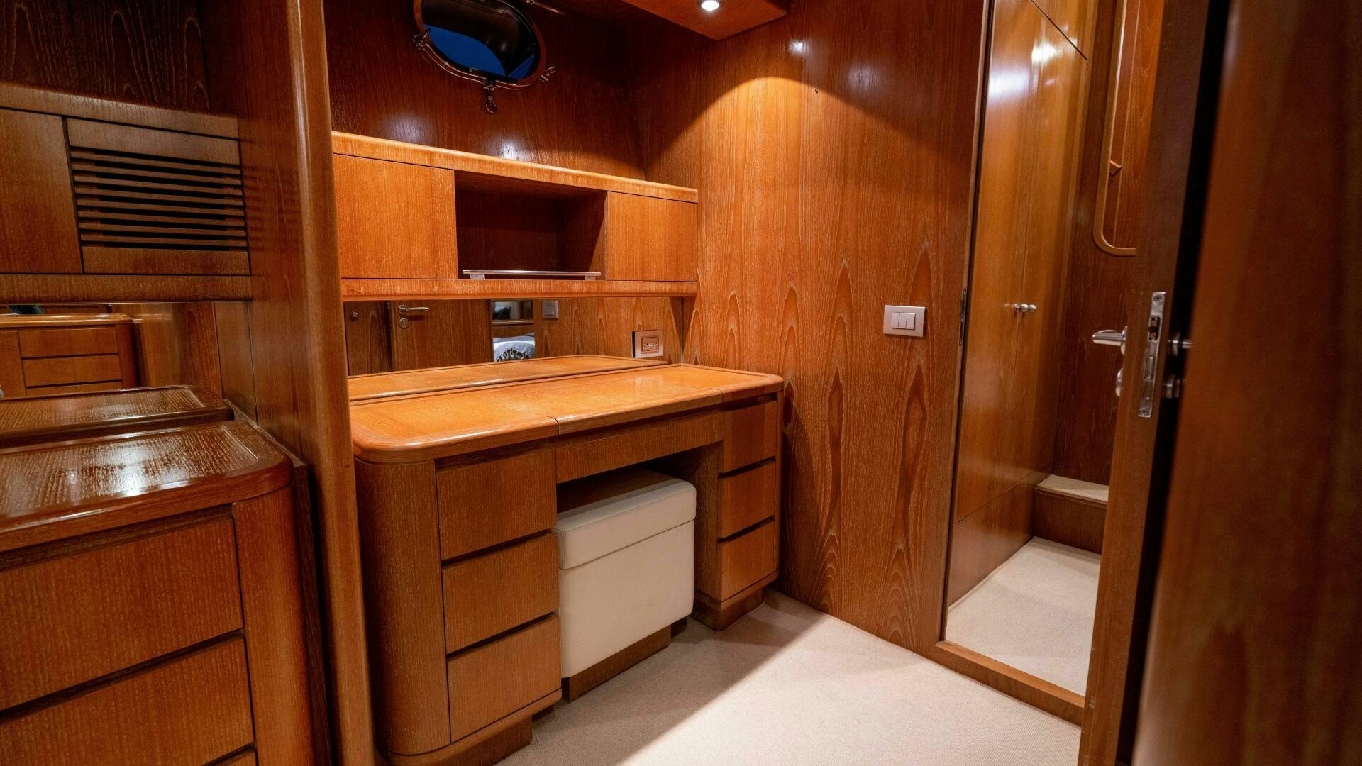 a bathroom with wooden cabinets aboard LOSAND Yacht for Sale