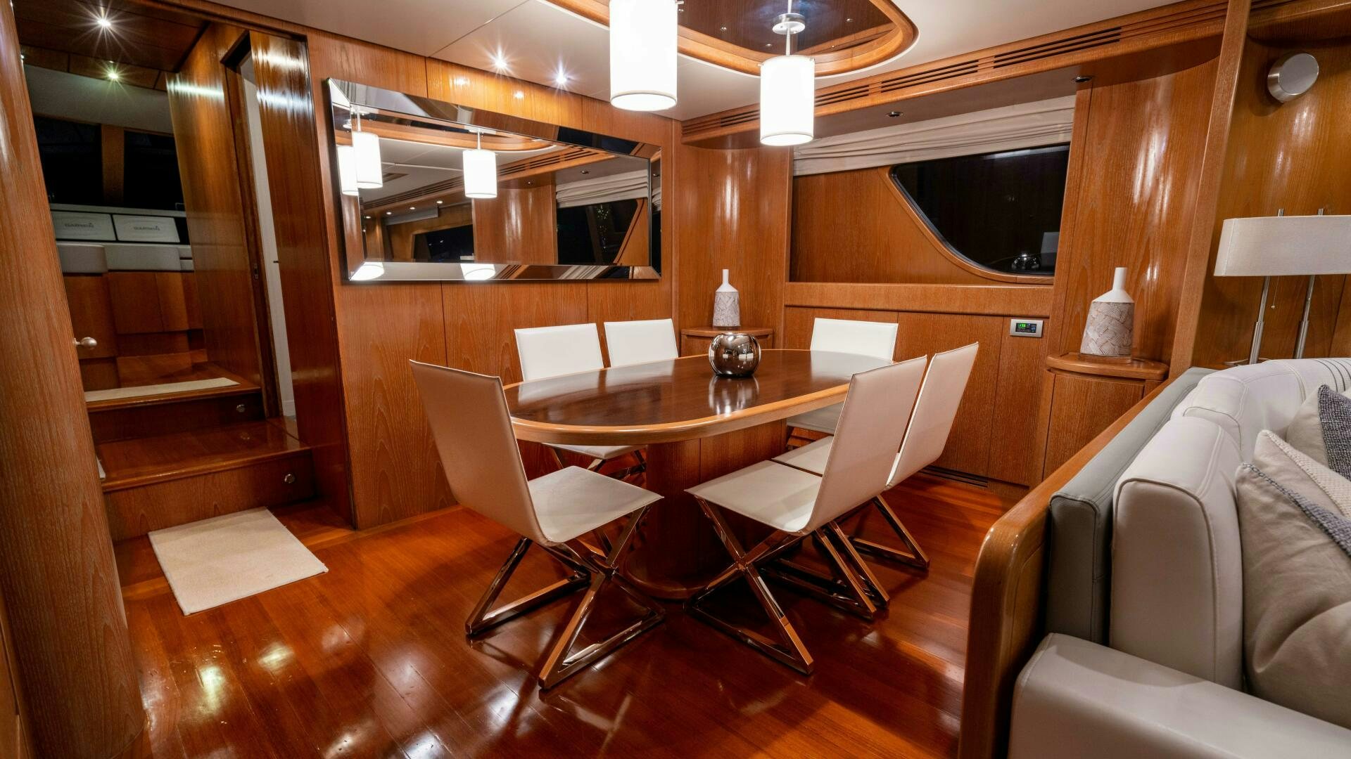 a room with a table and chairs aboard LOSAND Yacht for Sale
