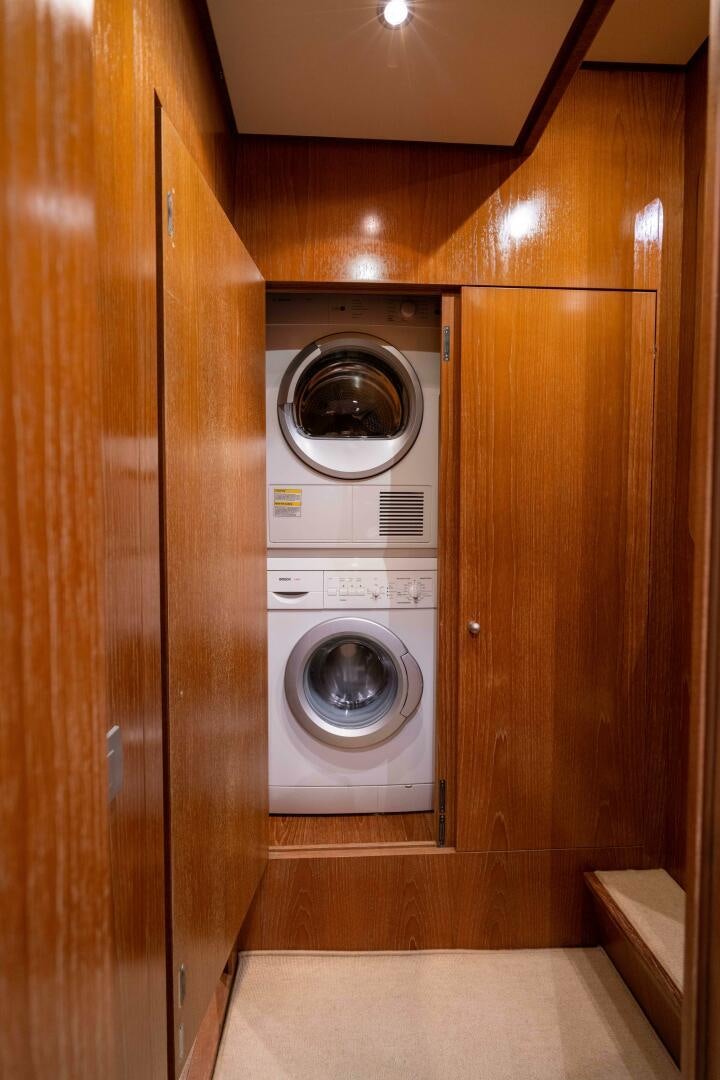 a washer and dryer in a closet aboard LOSAND Yacht for Sale