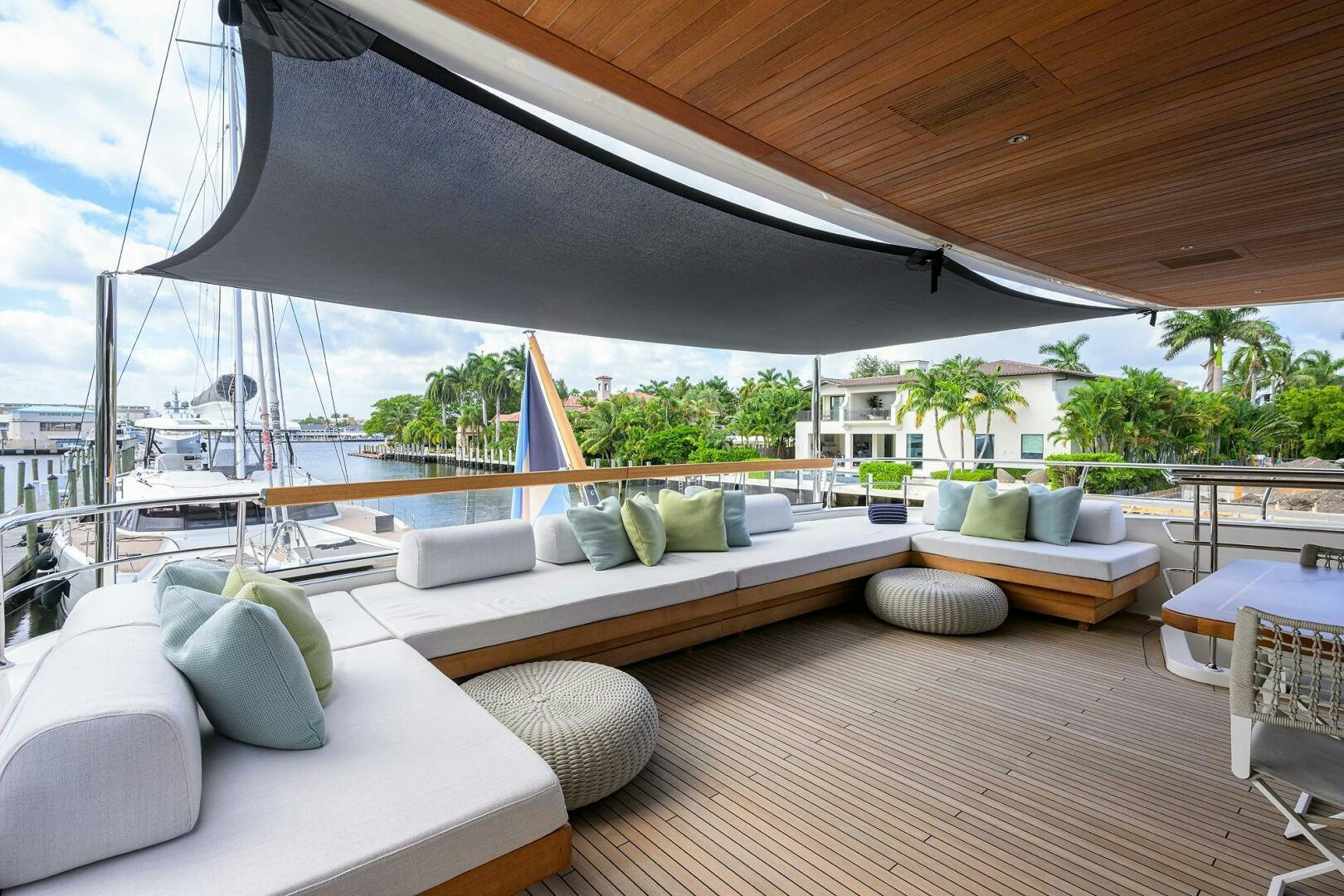 a large lounge area with a large deck and a large pool aboard GLORY Yacht for Sale