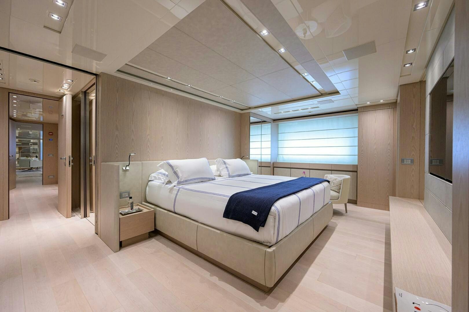 a large room with a bed and a window aboard GLORY Yacht for Sale