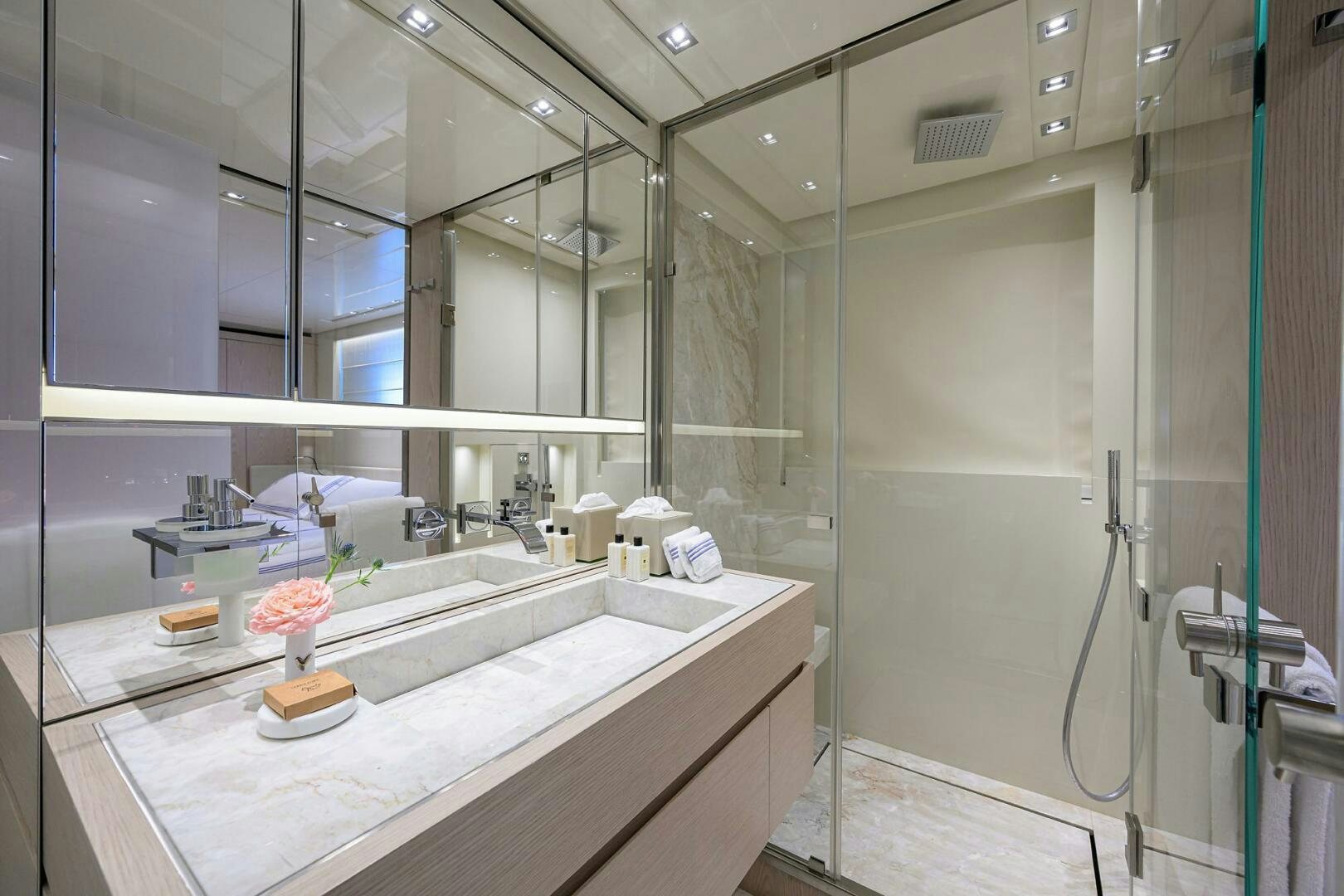 a bathroom with a large mirror aboard GLORY Yacht for Sale