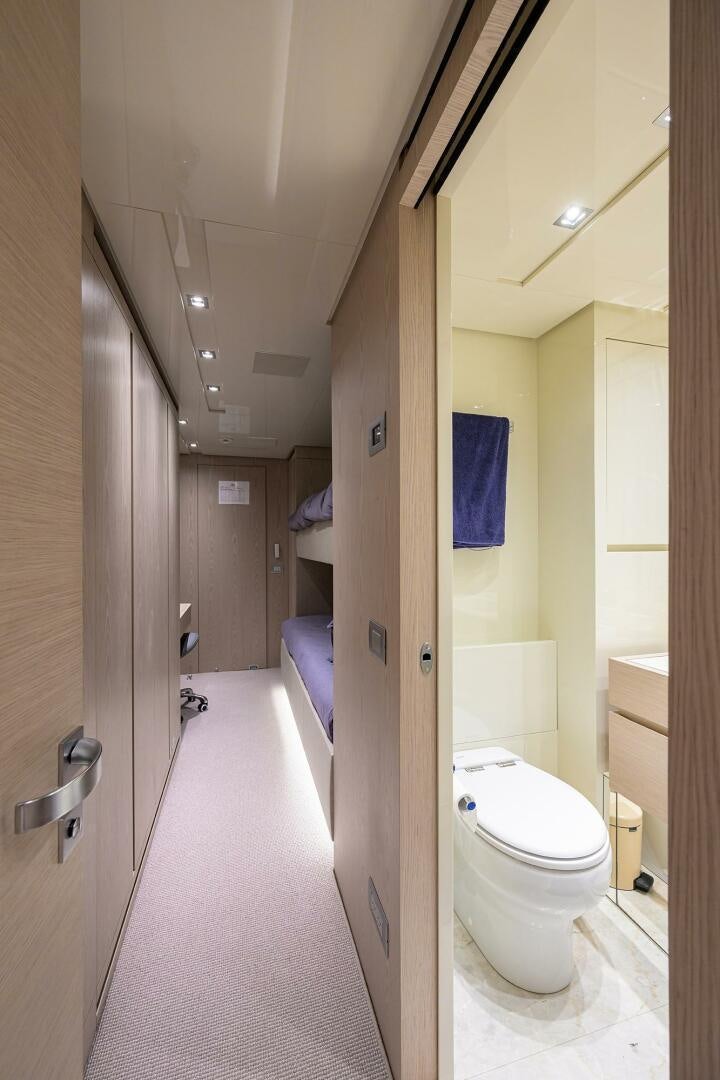 a bathroom with a toilet and a sink aboard GLORY Yacht for Sale