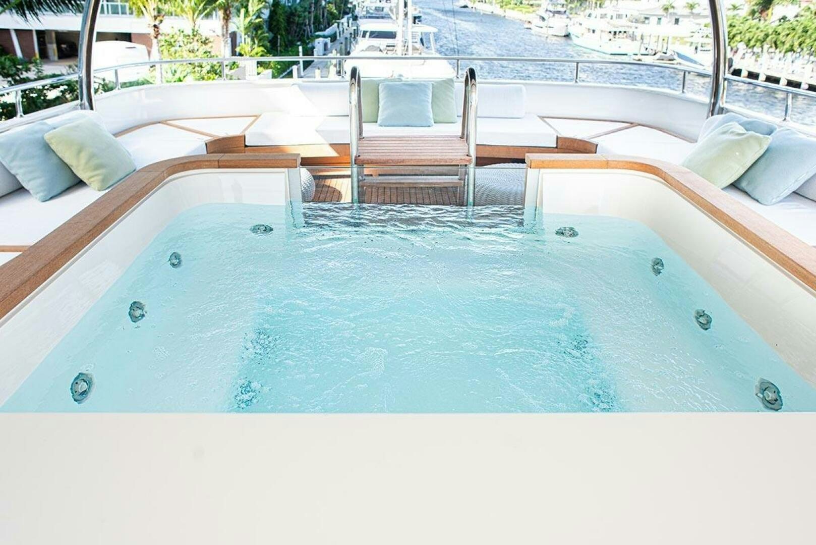 a pool with a chair on the deck aboard GLORY Yacht for Sale