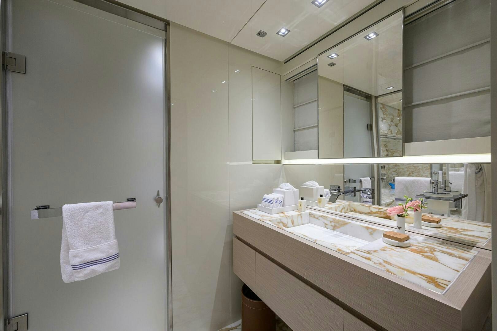 a bathroom with a countertop sink and mirror aboard GLORY Yacht for Sale