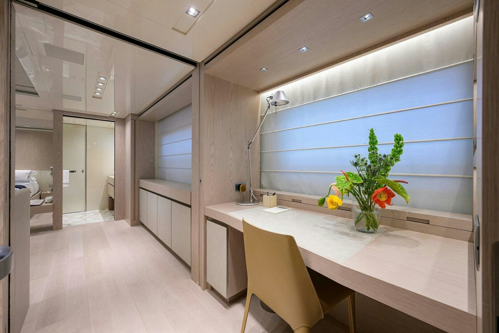 a room with a table and chairs aboard GLORY Yacht for Sale