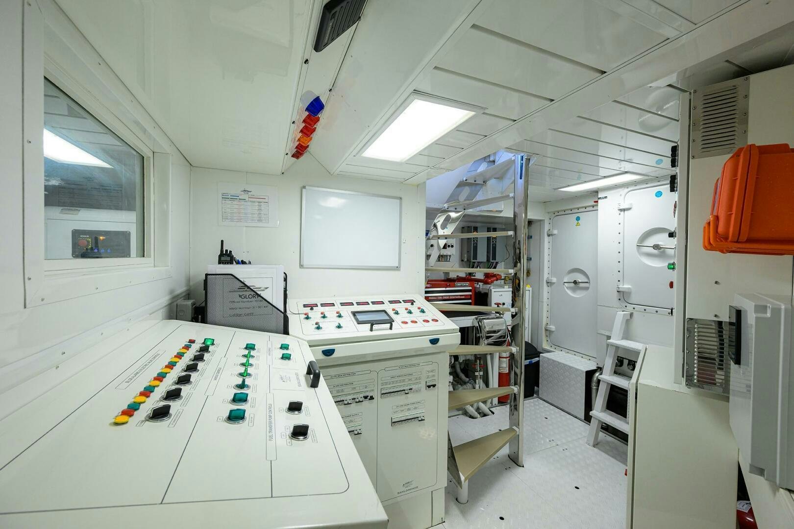 a room with a desk and computer aboard GLORY Yacht for Sale