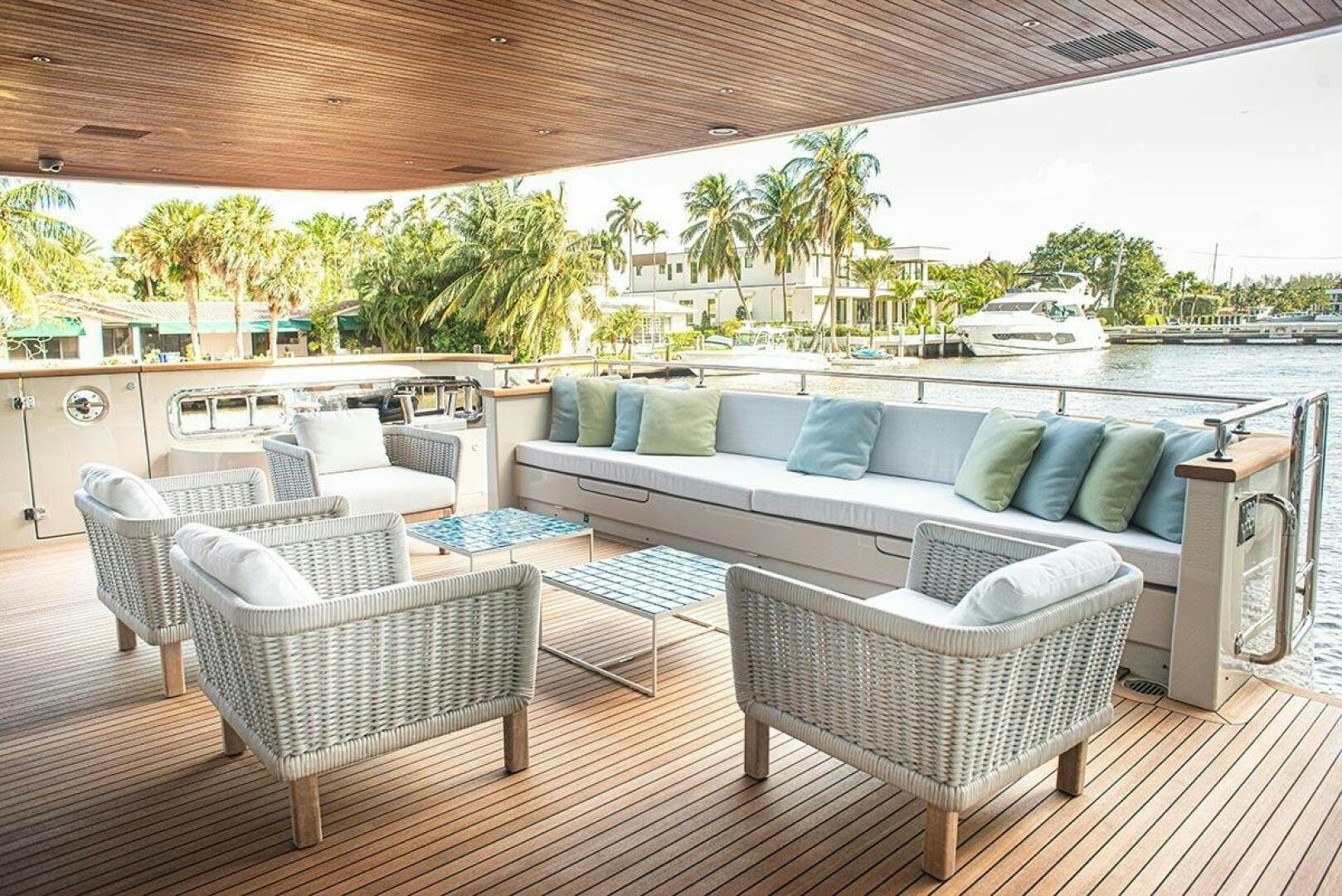 a patio with a couch and chairs aboard GLORY Yacht for Sale
