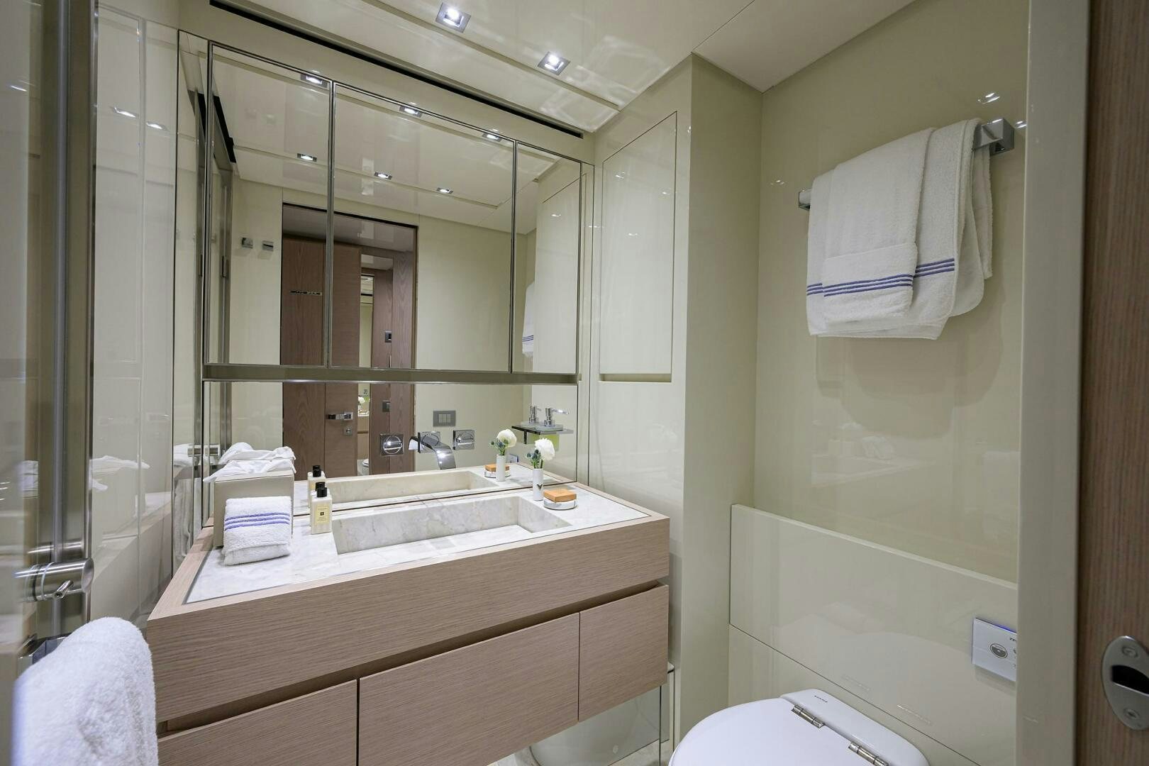a bathroom with a large mirror aboard GLORY Yacht for Sale