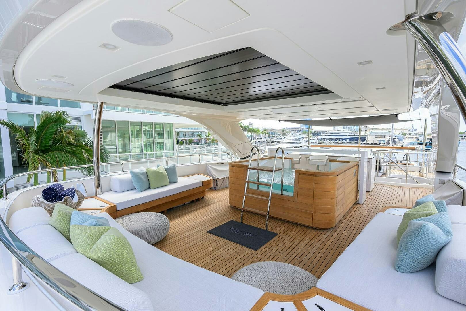 a room with a large bed and a large window aboard GLORY Yacht for Sale