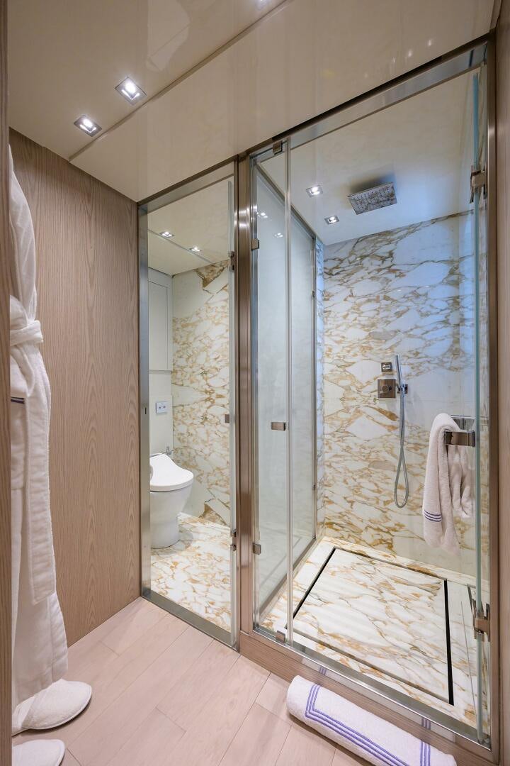 a bathroom with a glass shower aboard GLORY Yacht for Sale