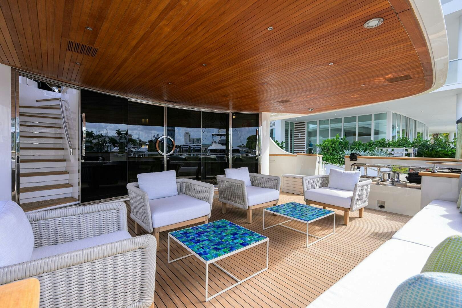 a room with a table chairs and a staircase aboard GLORY Yacht for Sale