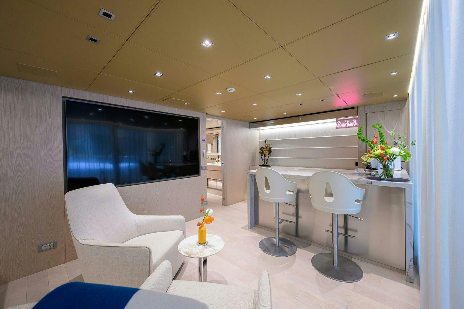 a room with a table and chairs aboard GLORY Yacht for Sale