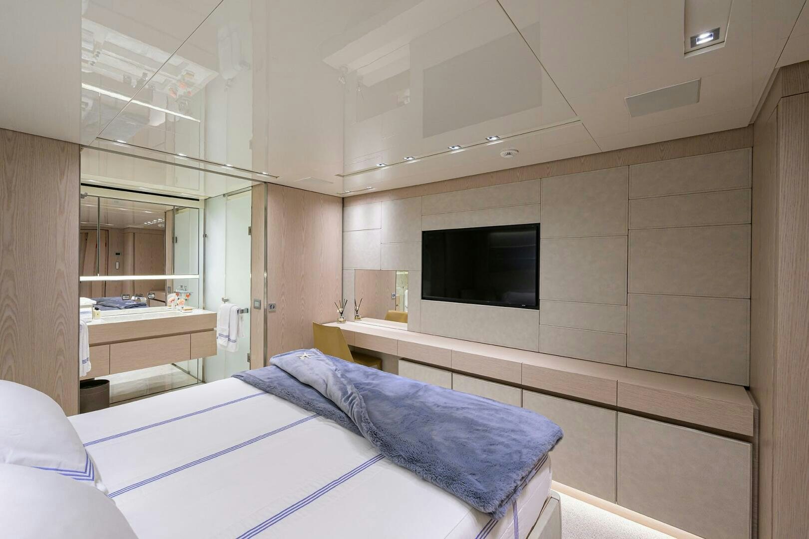 a room with a bed and a tv aboard GLORY Yacht for Sale