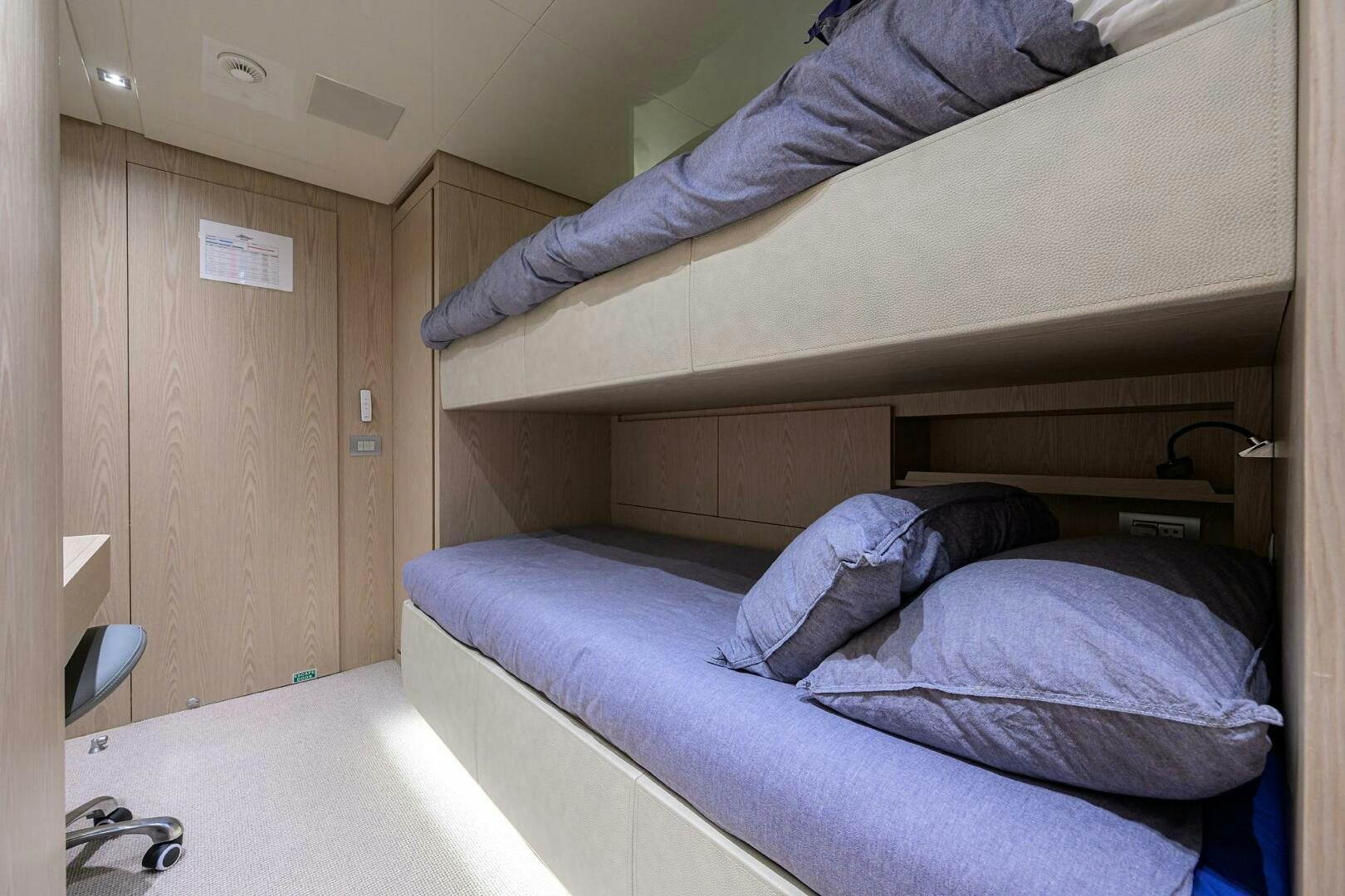 a person lying on a bed aboard GLORY Yacht for Sale