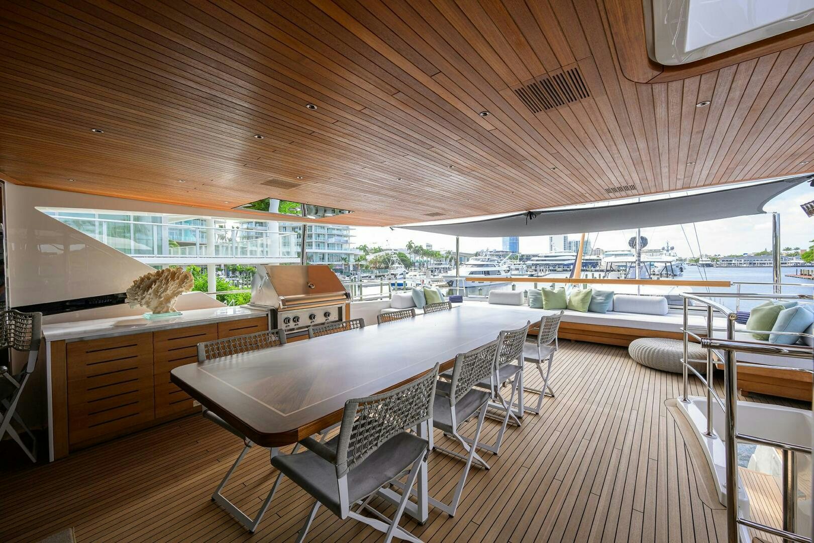 a room with tables and chairs aboard GLORY Yacht for Sale