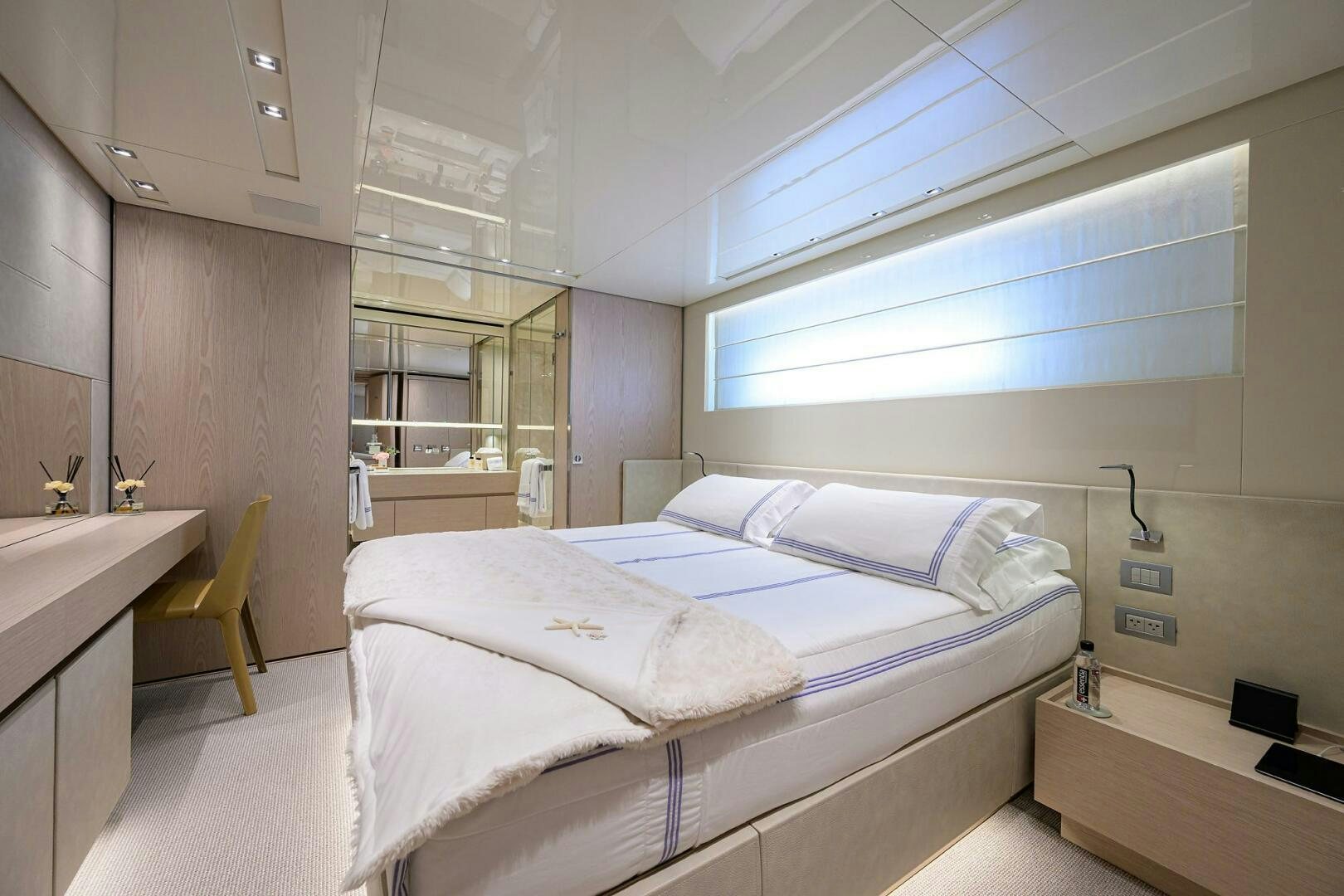 a room with a bed and a window aboard GLORY Yacht for Sale