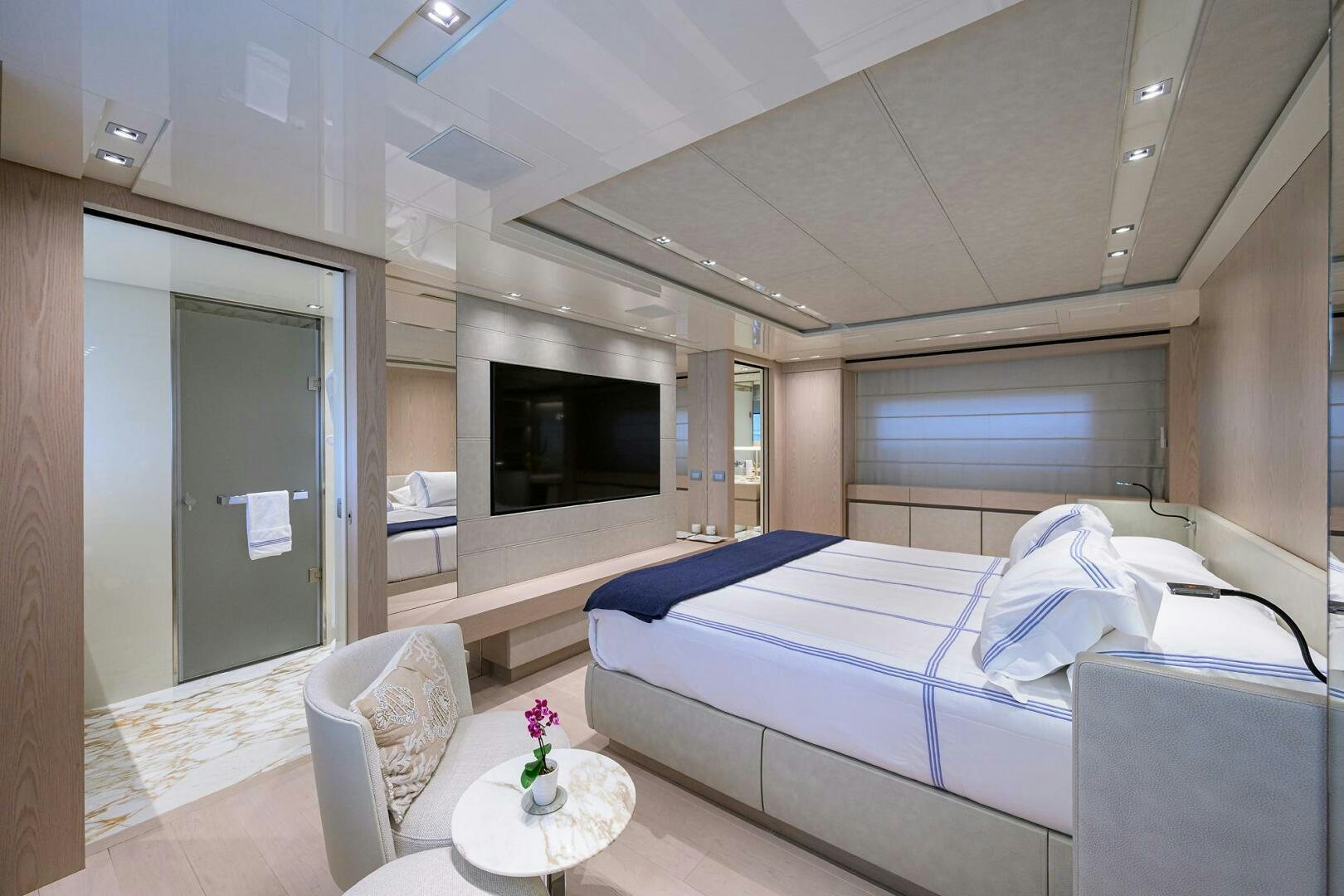 a room with a bed and a television aboard GLORY Yacht for Sale