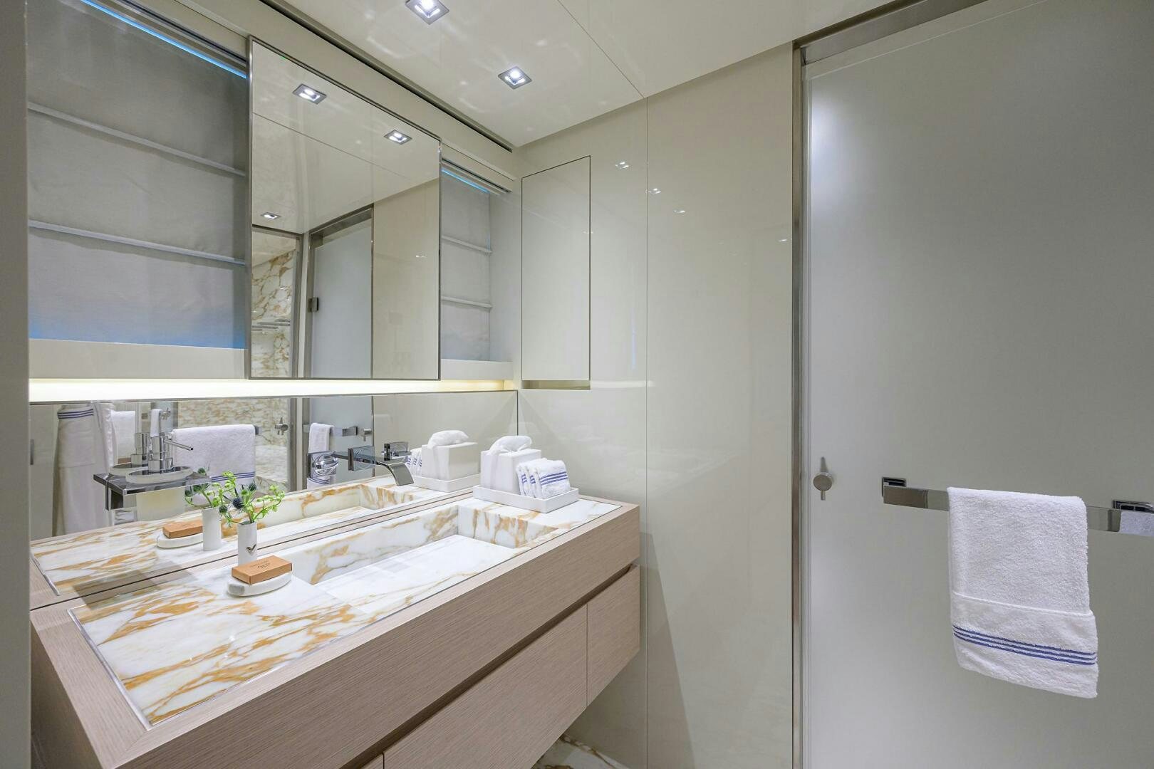 a bathroom with a countertop sink and mirror aboard GLORY Yacht for Sale
