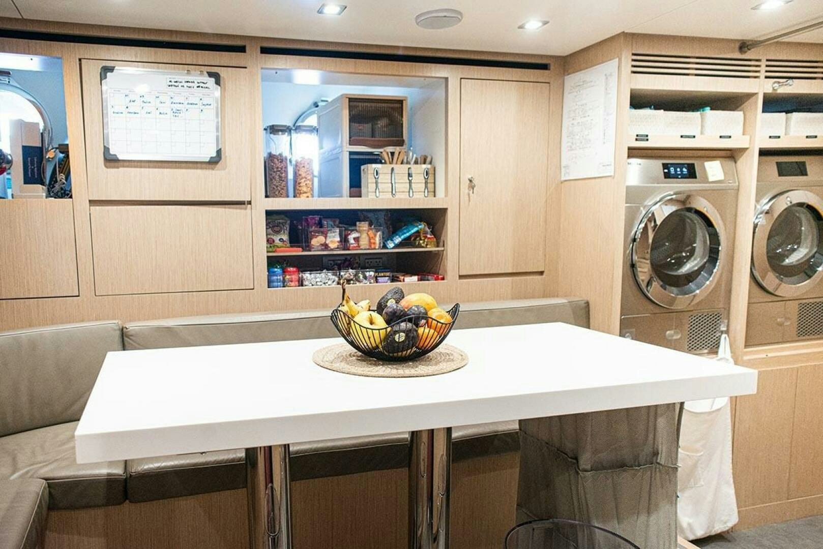 a kitchen with a table and a microwave aboard GLORY Yacht for Sale