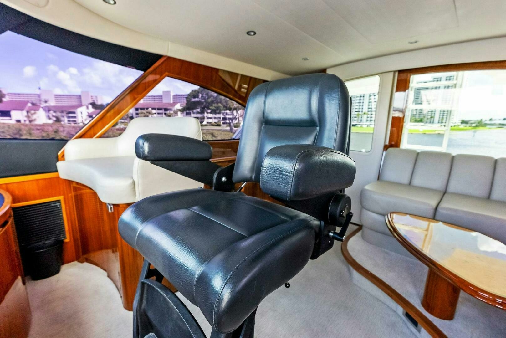 a car with a seat and a table in the back aboard PRINCESS LILY Yacht for Sale
