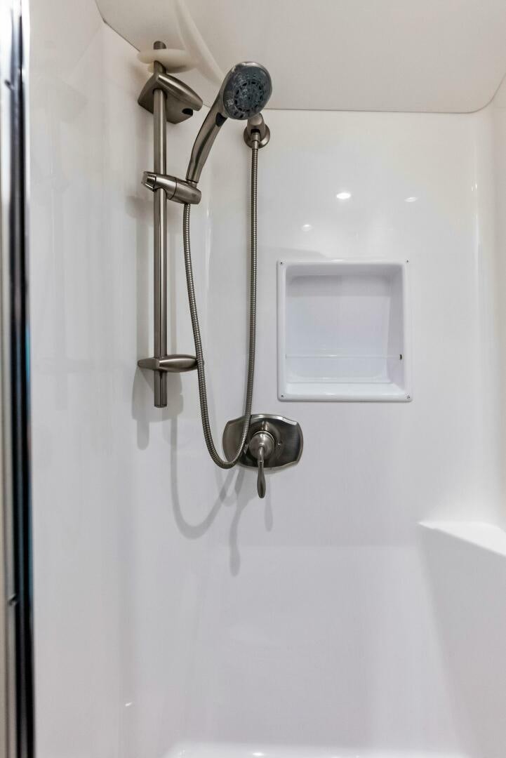 a shower head with a glass door aboard PRINCESS LILY Yacht for Sale
