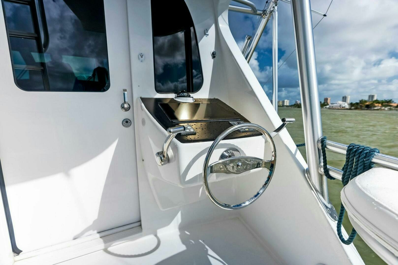 a white boat with a round window aboard PRINCESS LILY Yacht for Sale