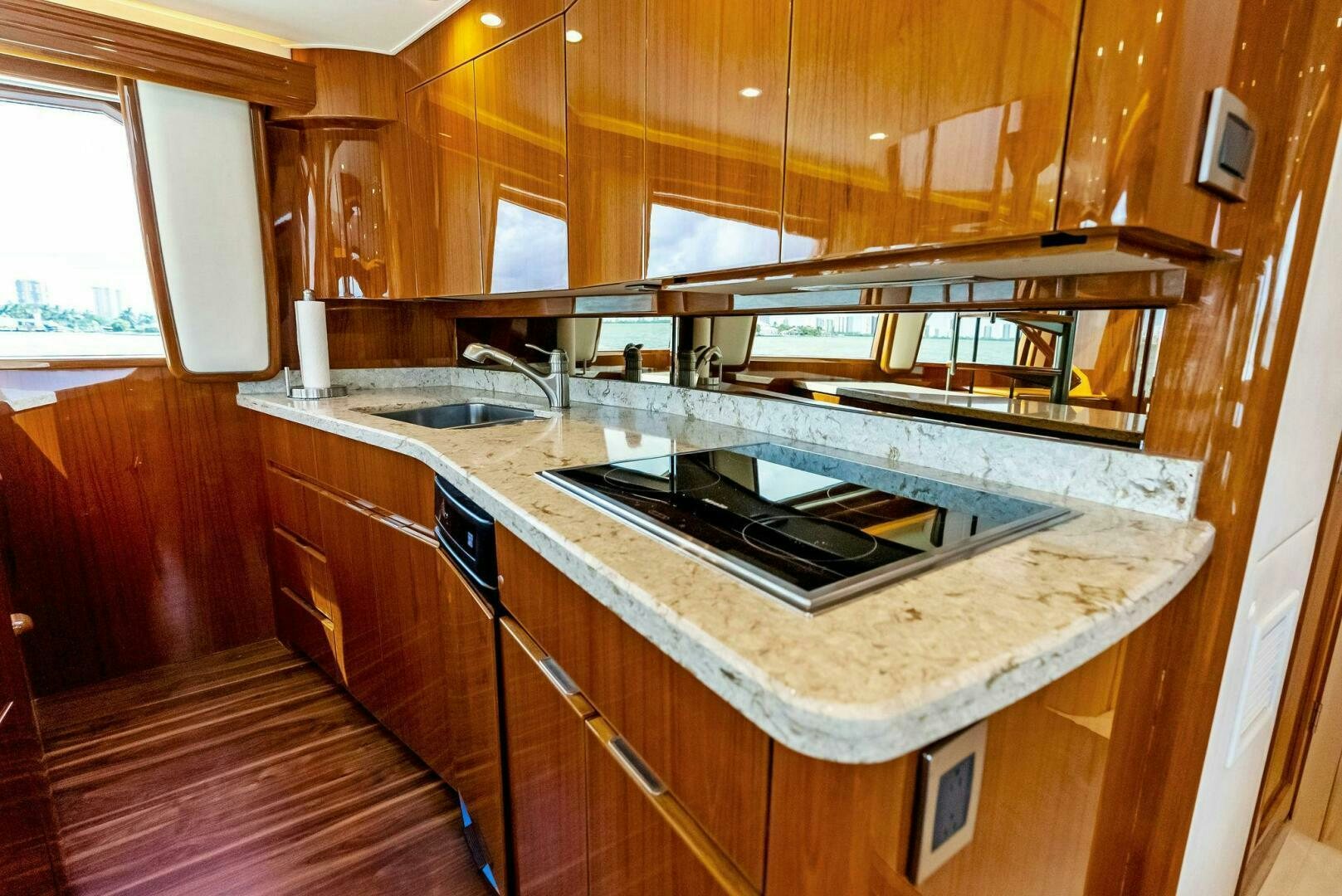 a kitchen with a stove and a sink aboard PRINCESS LILY Yacht for Sale