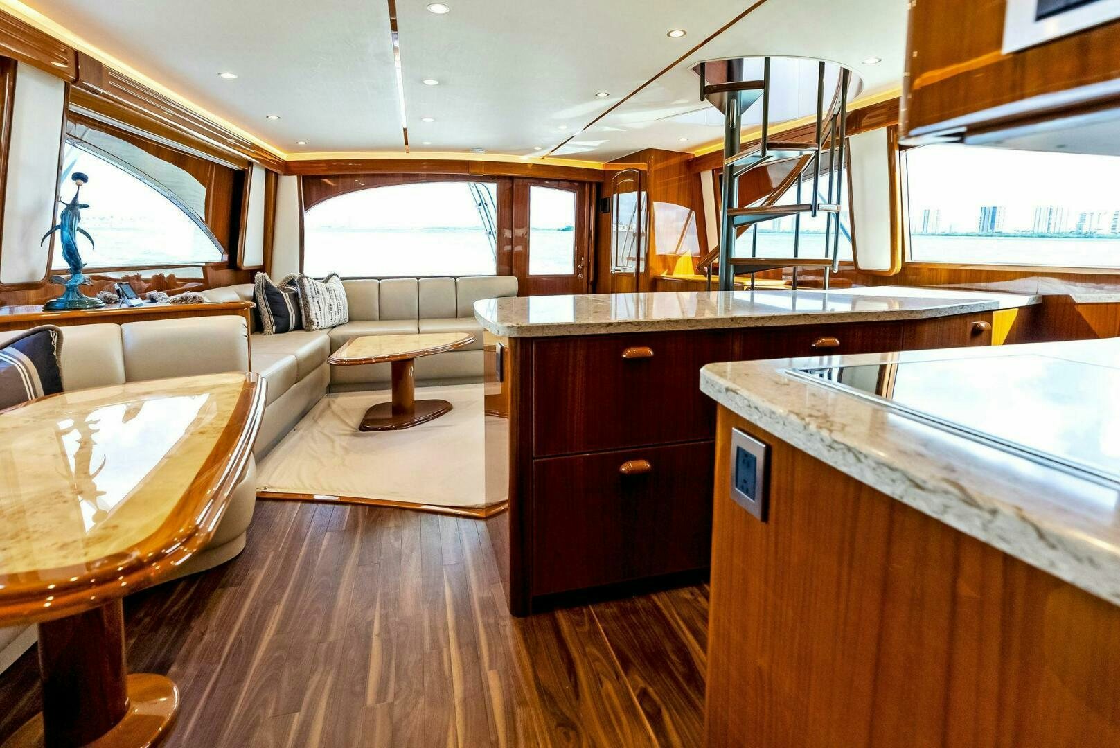 a room with a wood floor and a large window aboard PRINCESS LILY Yacht for Sale