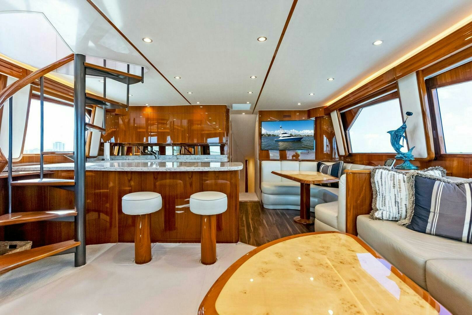 a living room with a large glass door aboard PRINCESS LILY Yacht for Sale