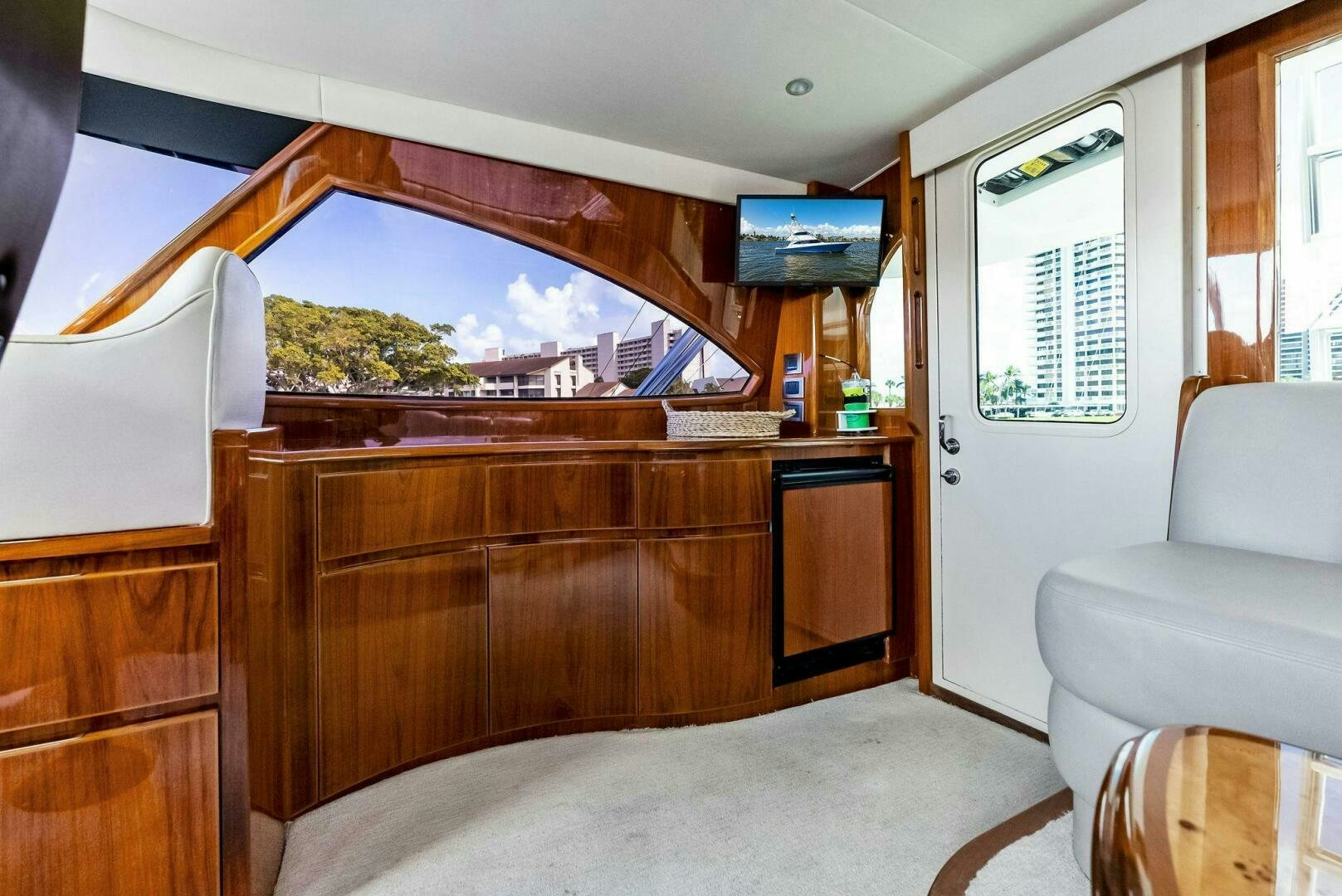 a room with a large window and a view of a city aboard PRINCESS LILY Yacht for Sale