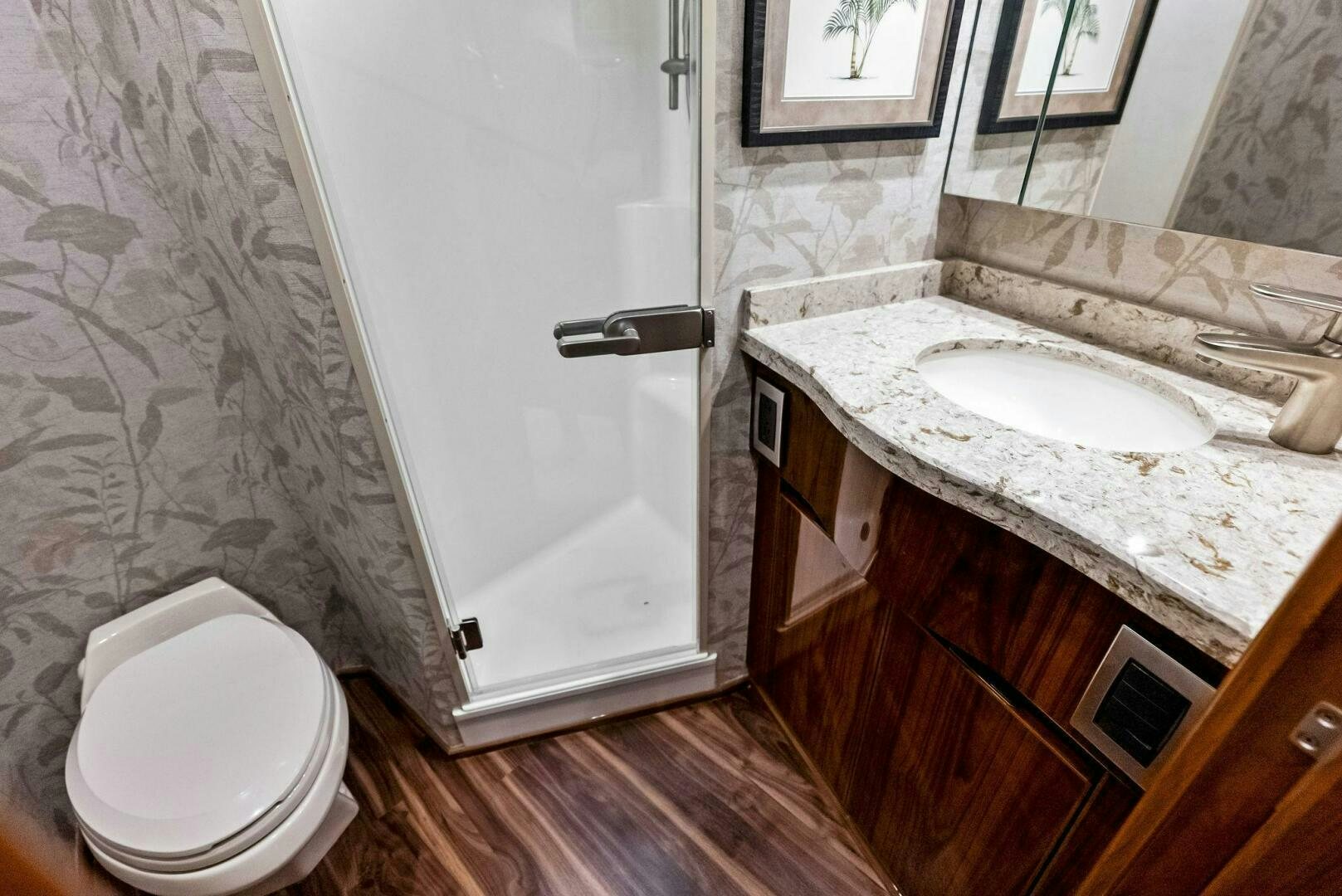 a bathroom with a toilet and sink aboard PRINCESS LILY Yacht for Sale
