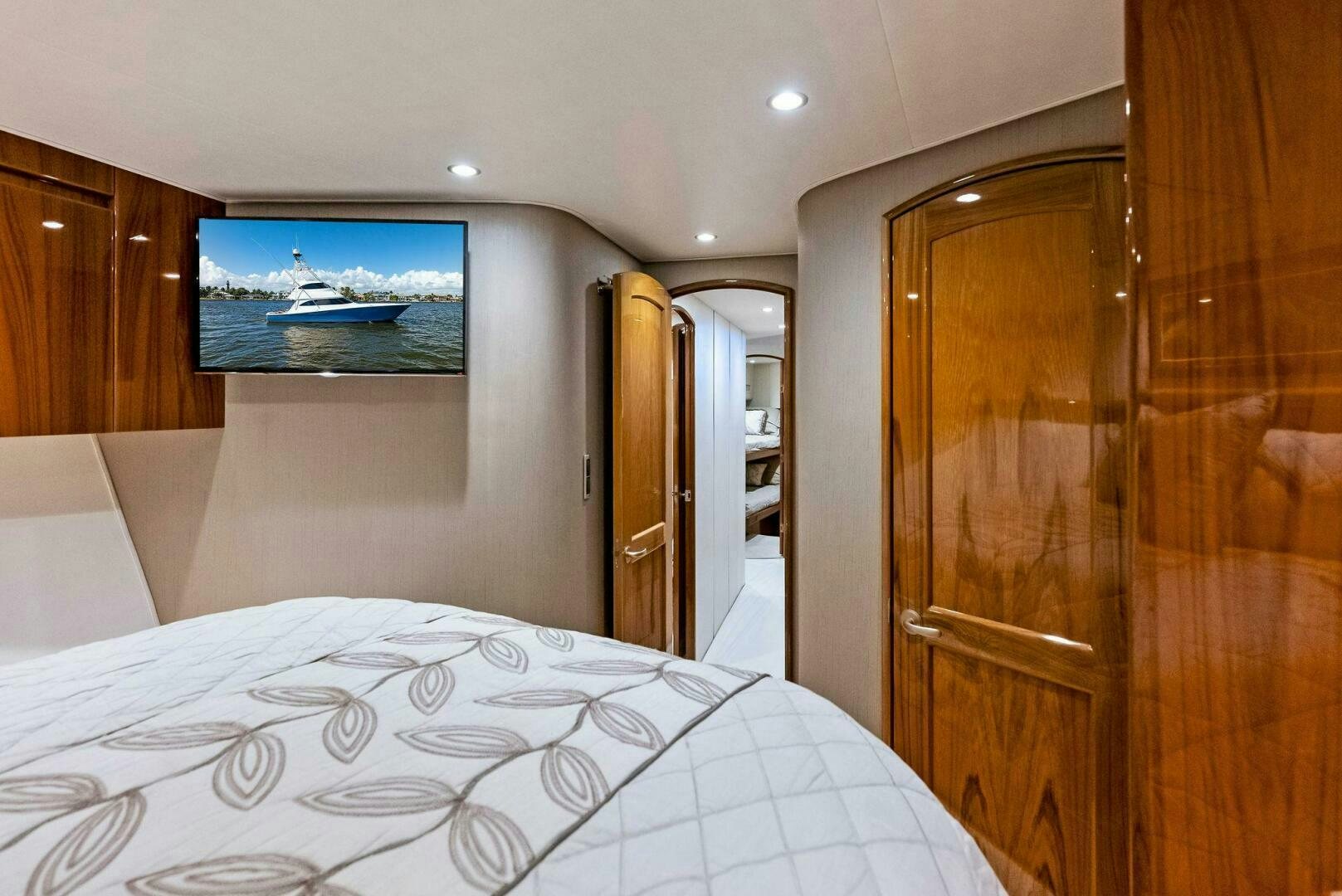 a bedroom with a large bed aboard PRINCESS LILY Yacht for Sale