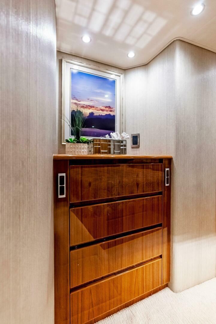a wood cabinet in a room aboard PRINCESS LILY Yacht for Sale