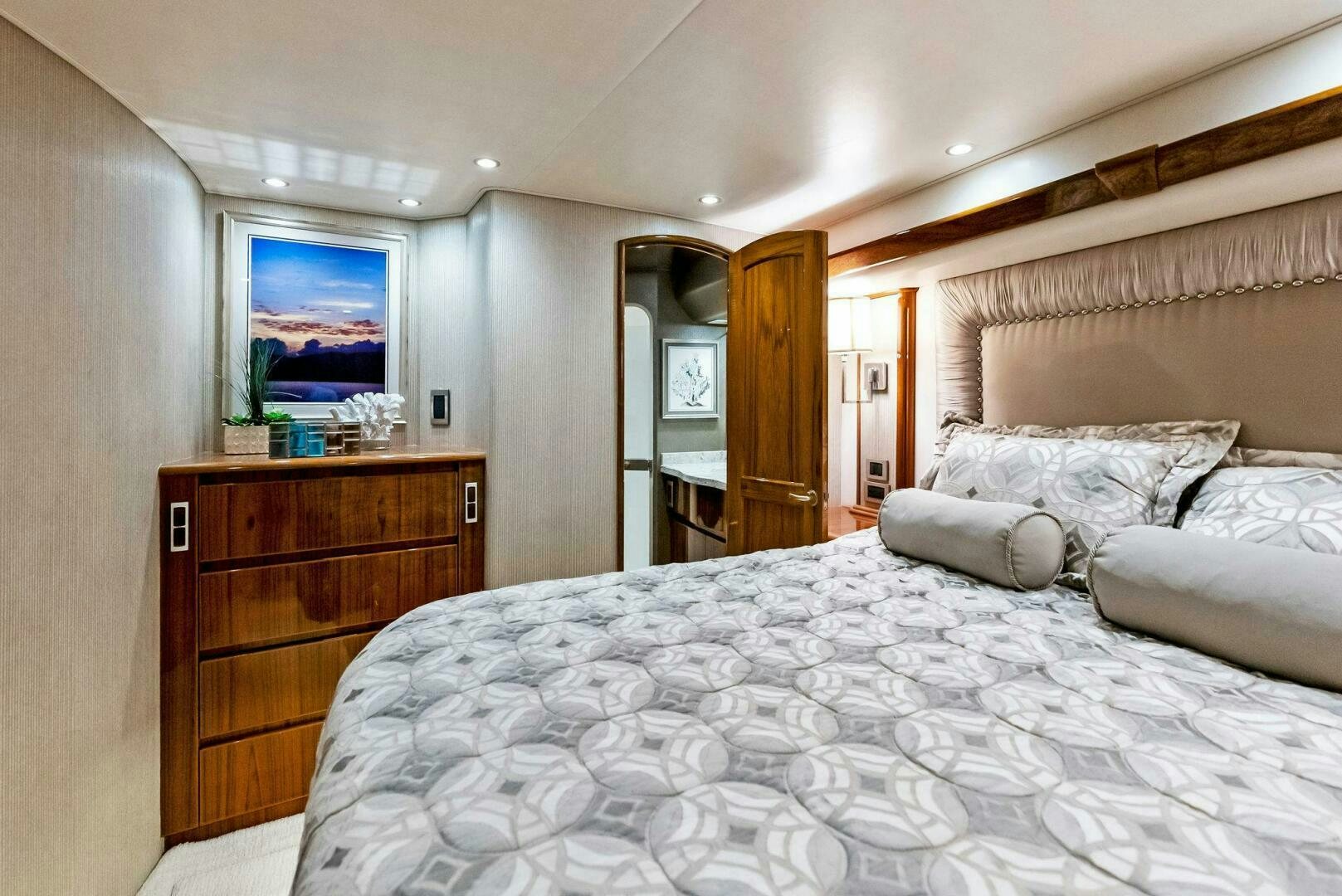 a bedroom with a large bed aboard PRINCESS LILY Yacht for Sale