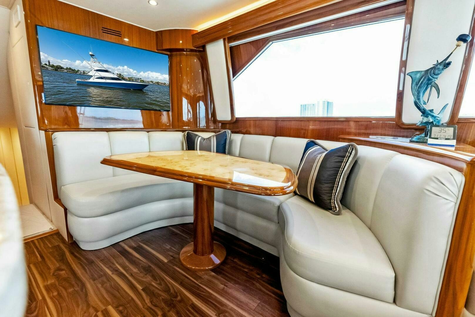 a living room with a couch and a table aboard PRINCESS LILY Yacht for Sale