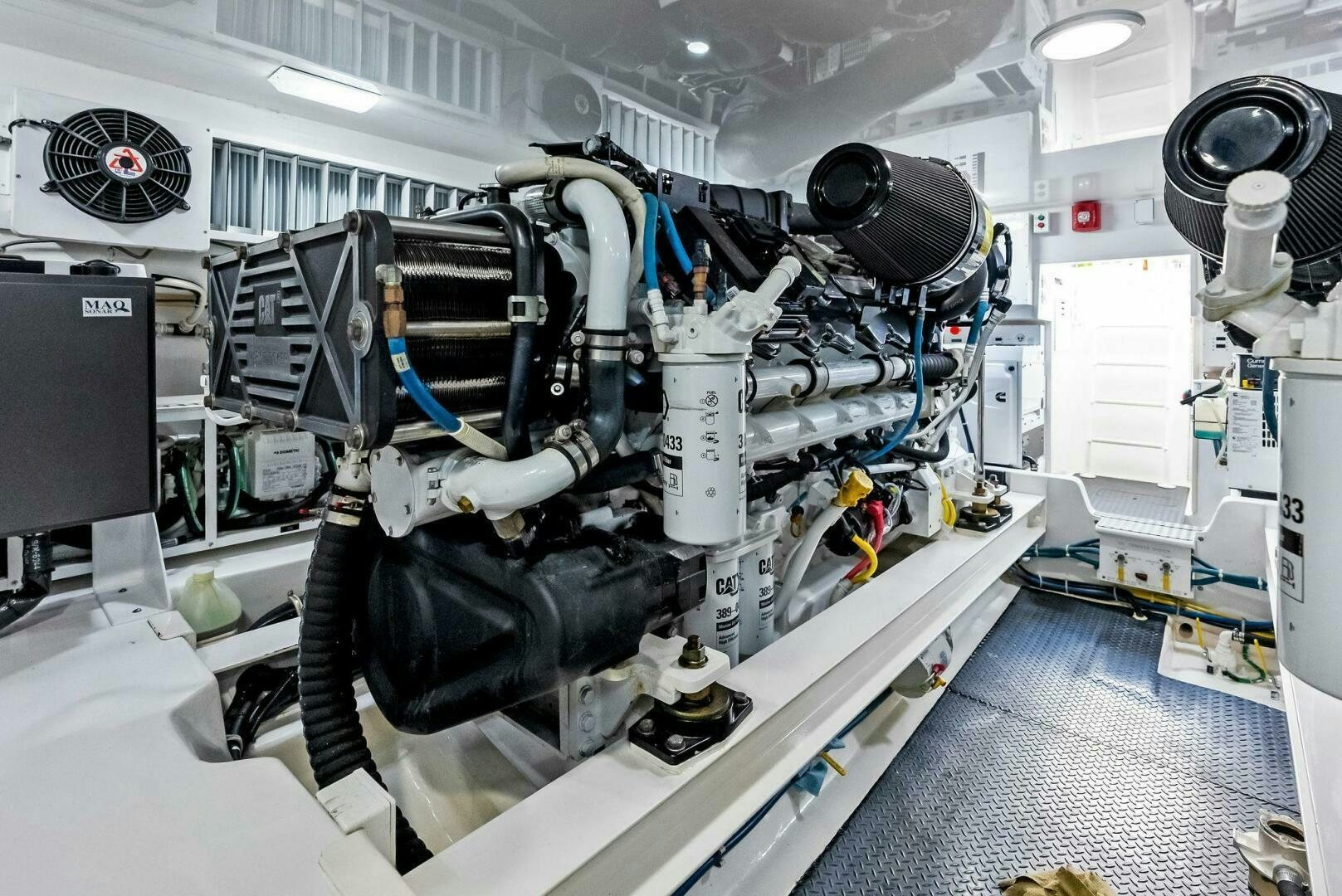 a car with a large engine aboard PRINCESS LILY Yacht for Sale