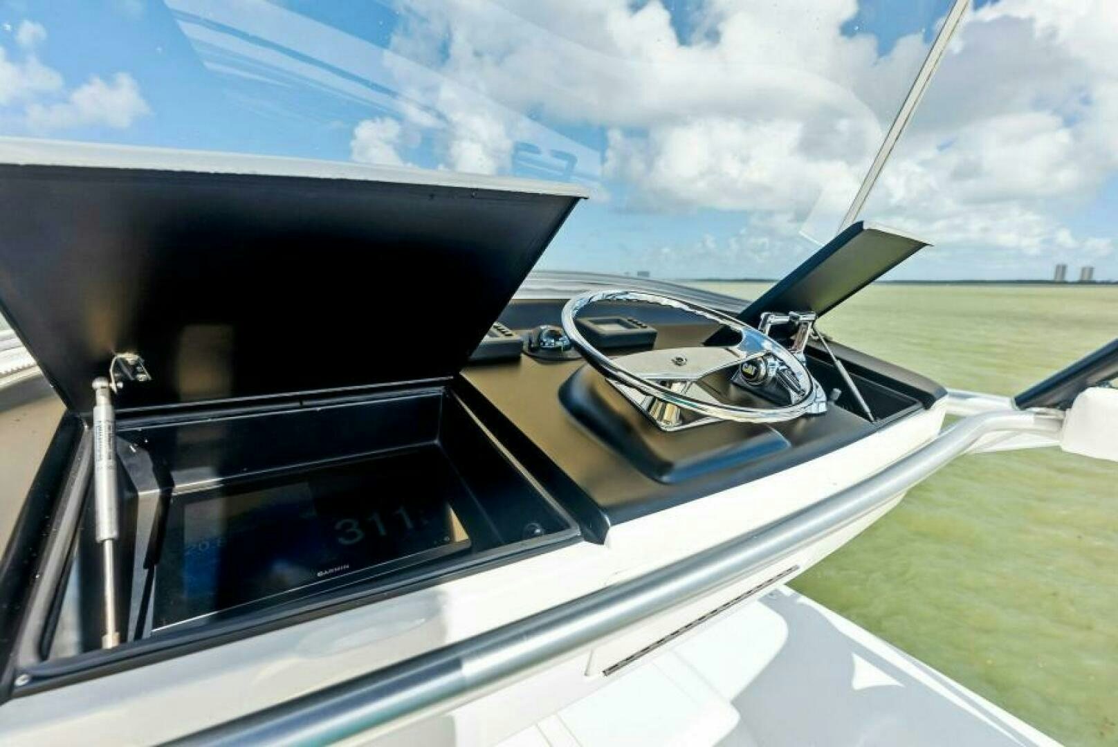 a car with a steering wheel aboard PRINCESS LILY Yacht for Sale