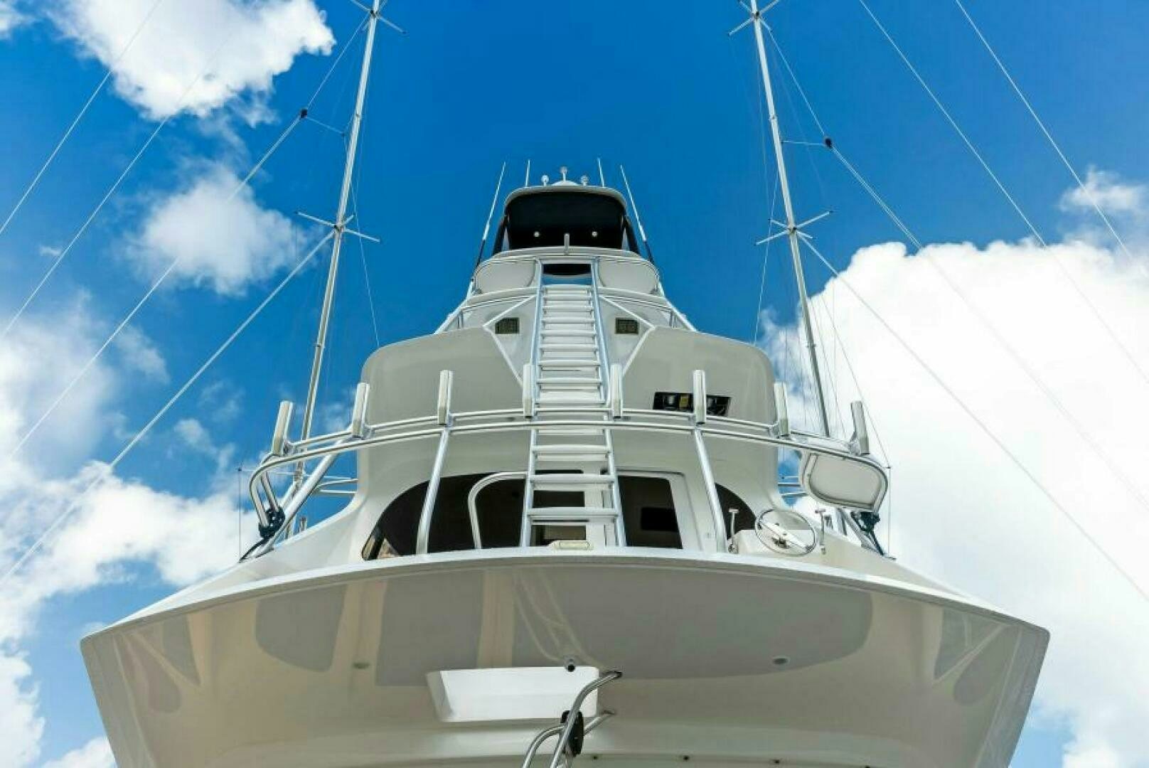 a white boat on a sunny day aboard PRINCESS LILY Yacht for Sale