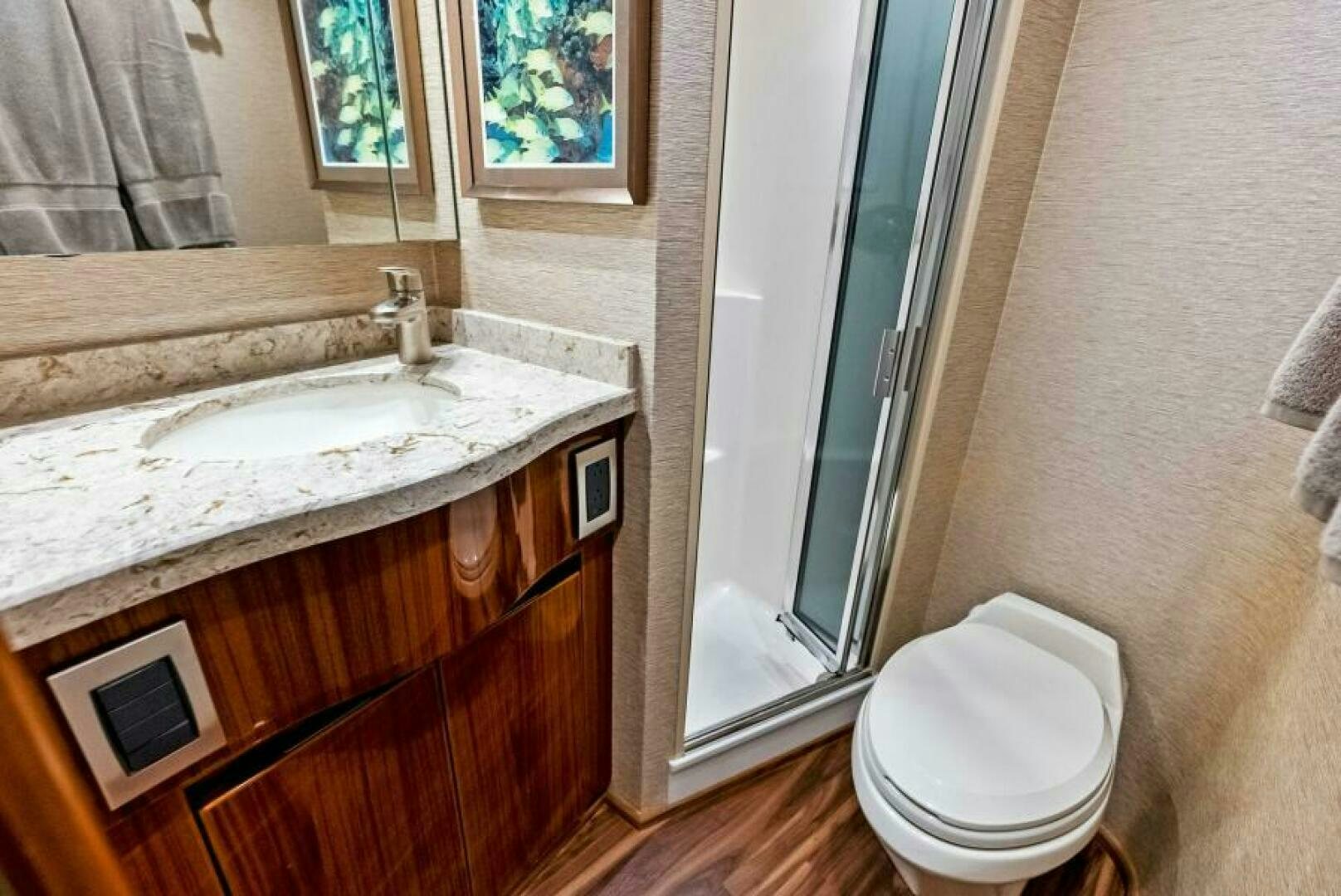 a bathroom with a sink and a toilet aboard PRINCESS LILY Yacht for Sale