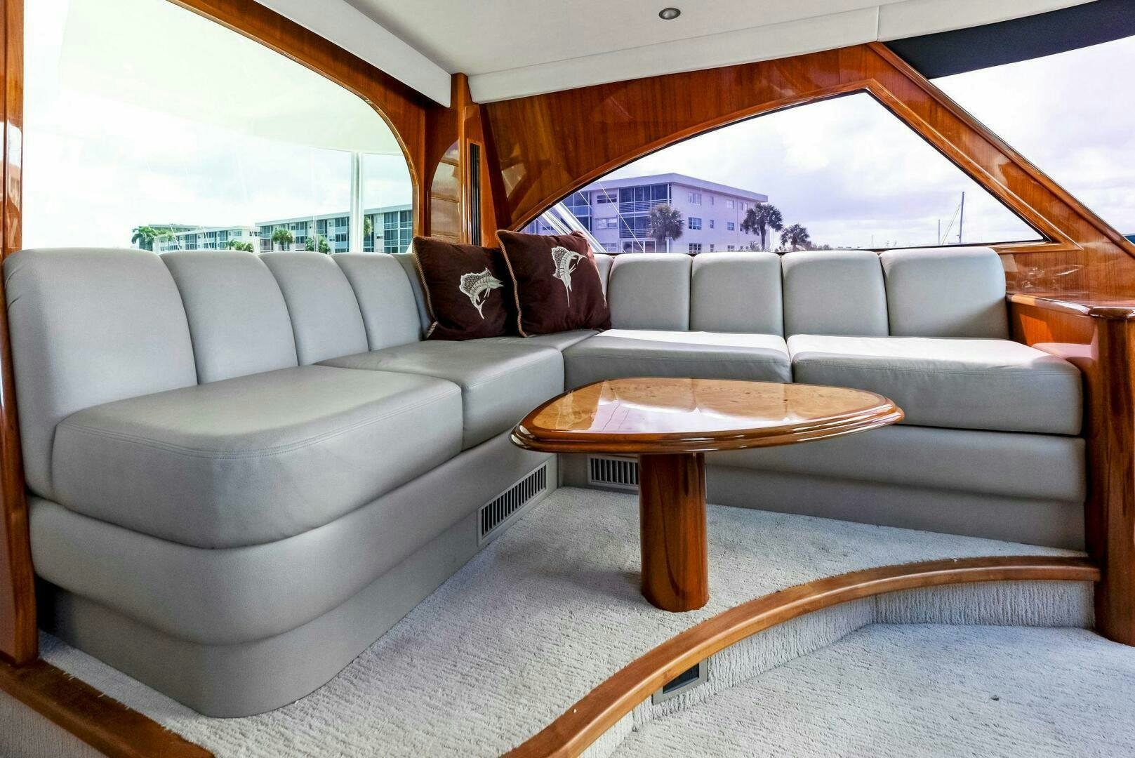 a couch and a table in a room aboard PRINCESS LILY Yacht for Sale