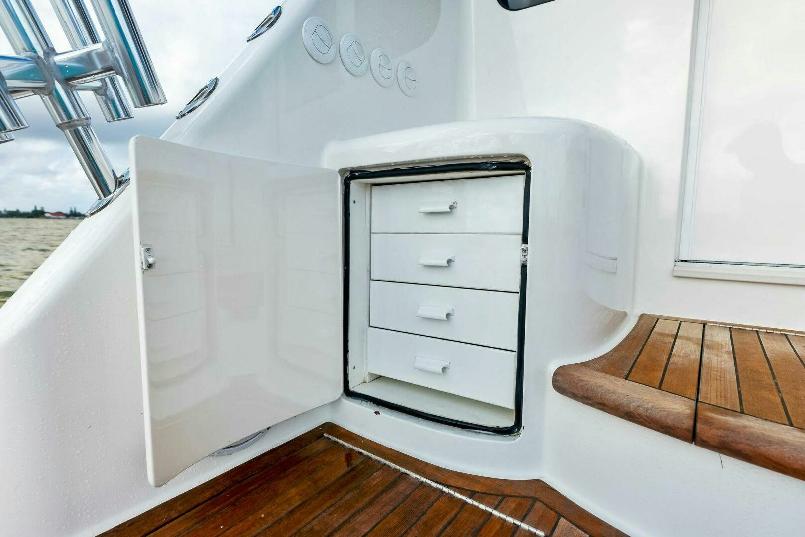 a white bed with drawers aboard PRINCESS LILY Yacht for Sale