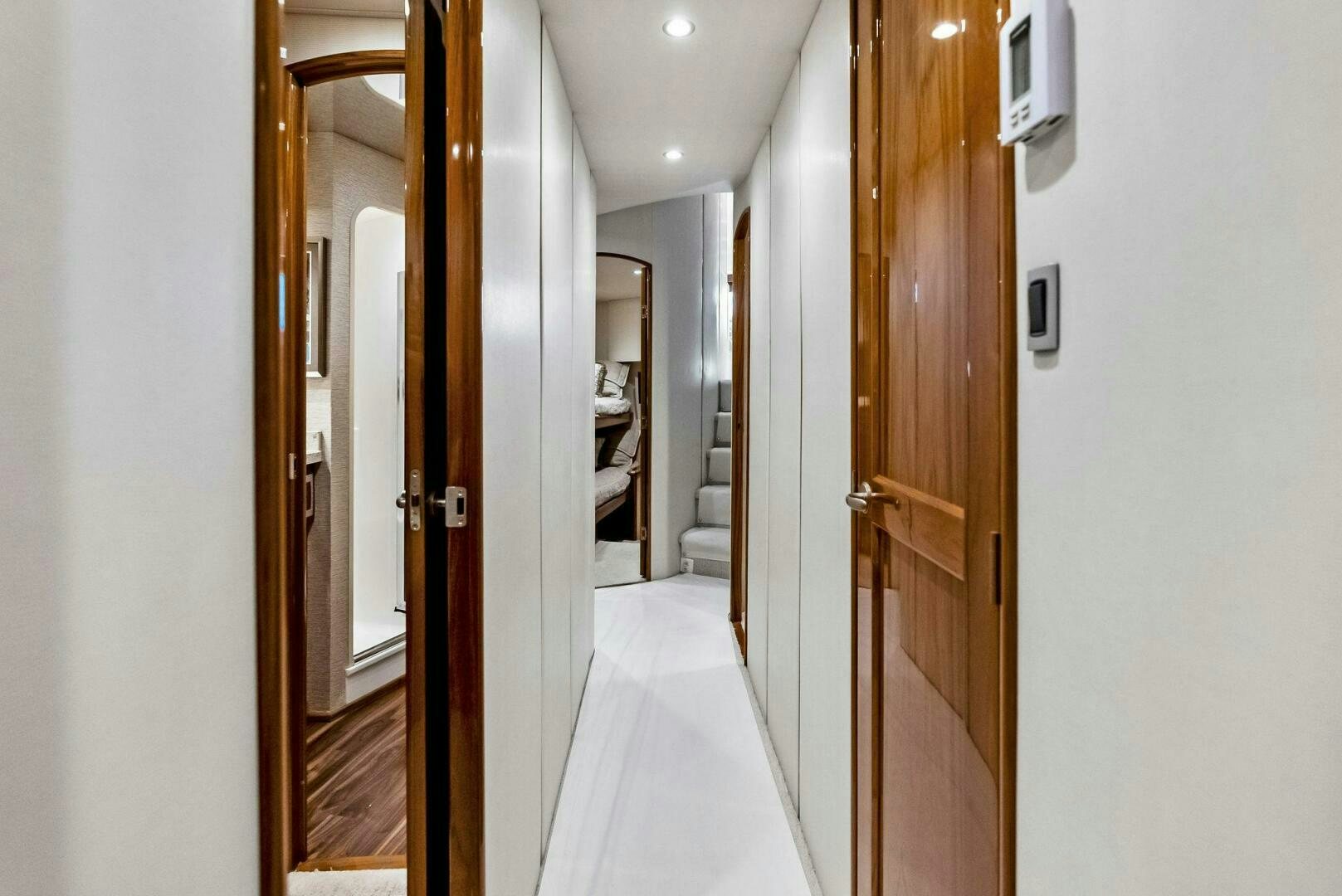 a hallway with doors aboard PRINCESS LILY Yacht for Sale