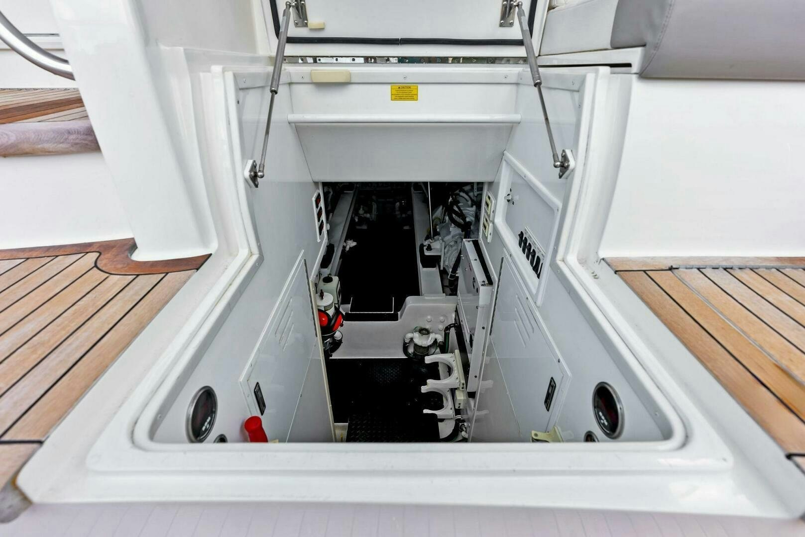 a white machine with a red line aboard PRINCESS LILY Yacht for Sale