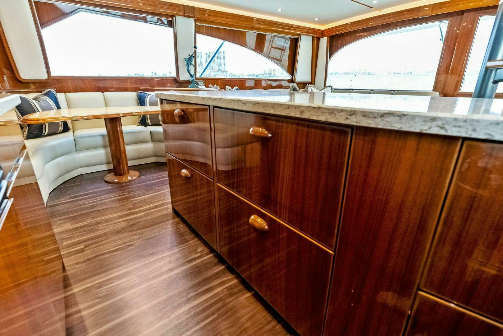 a kitchen with wooden cabinets aboard PRINCESS LILY Yacht for Sale