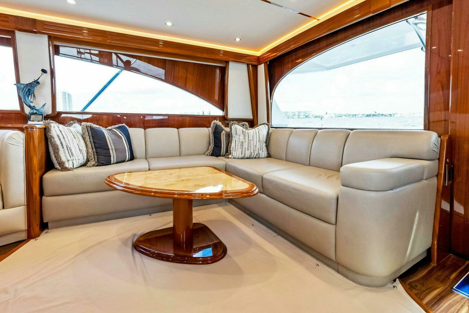 a living room with a couch and a coffee table aboard PRINCESS LILY Yacht for Sale