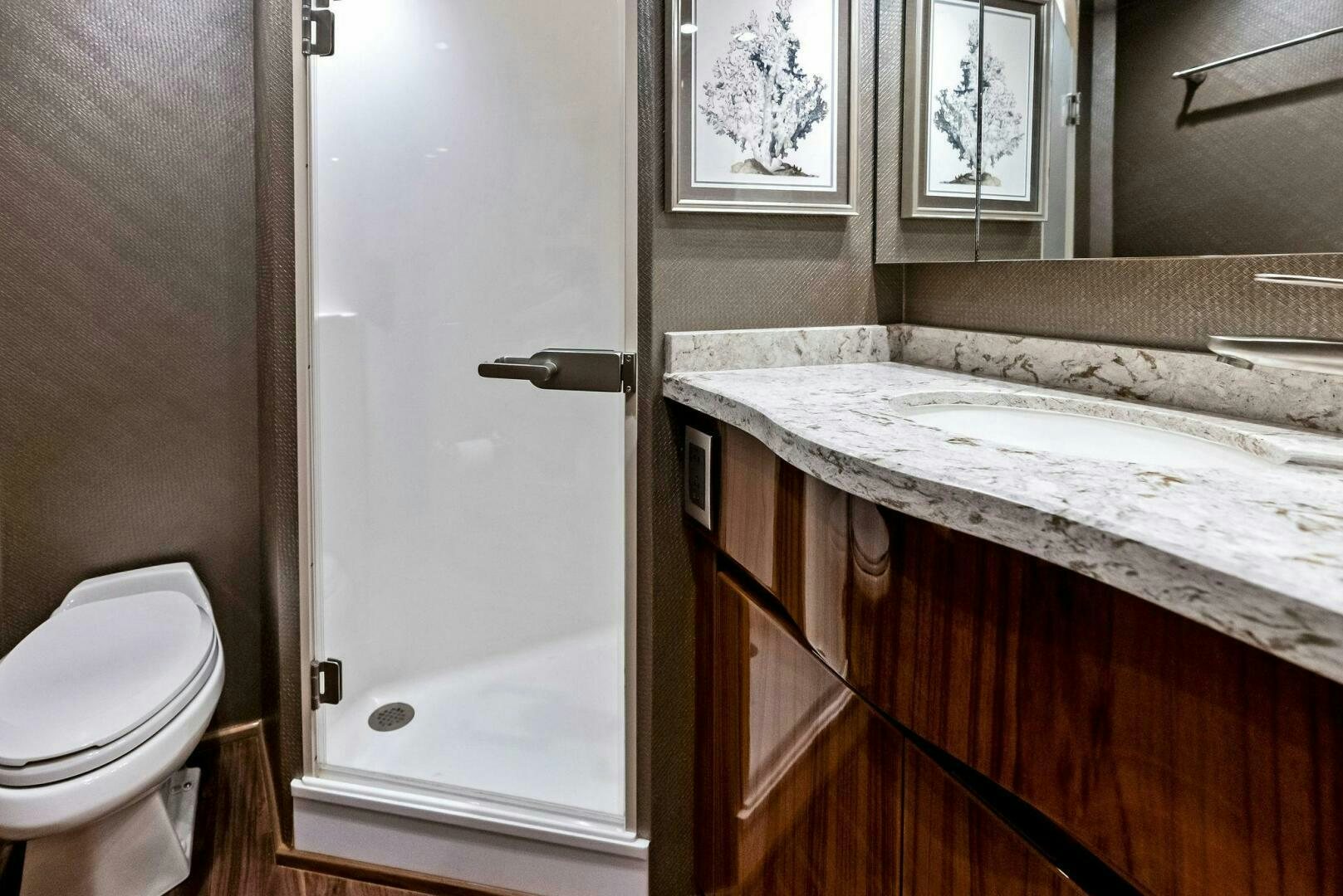 a bathroom with a sink and a toilet aboard PRINCESS LILY Yacht for Sale